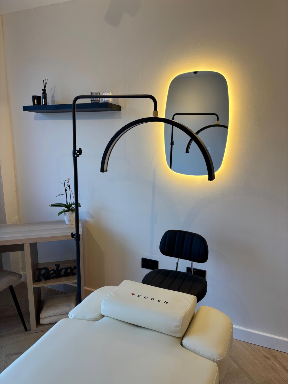 Treatment bed with light above