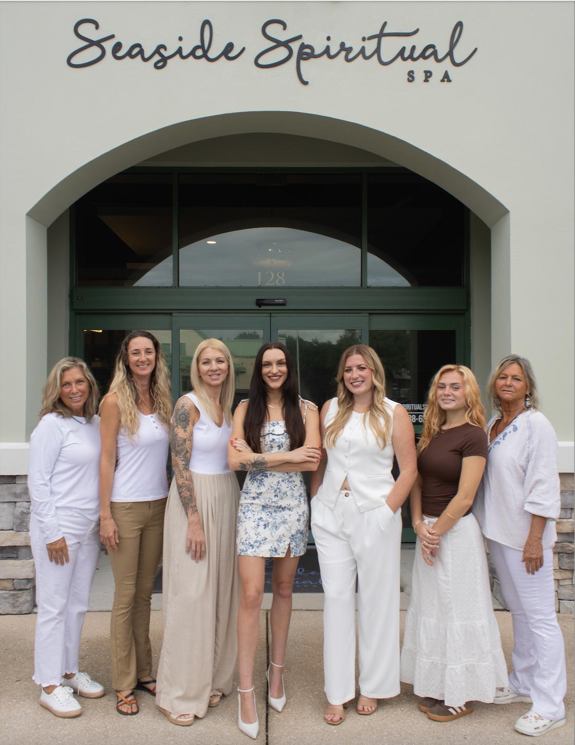 The Seaside Spiritual Spa team of licensed estheticians and massage therapists outside the spa entrance in St. Augustine Beach, Florida